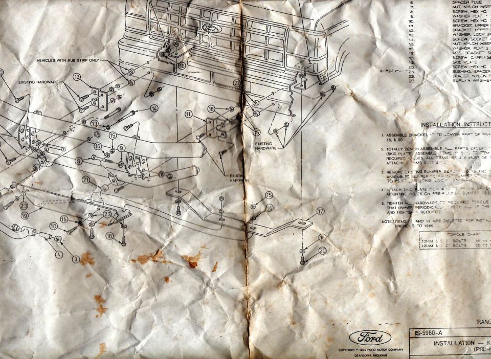 Crumpled installation sheet with exploded bumper hardware assembly diagram and parts list