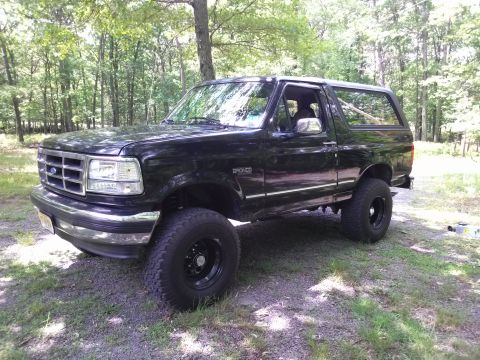 1995 Ford Bronco - Black 1995 Ford Bronco XLT parked outdoors on a sunny day.