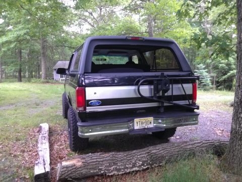 1995 Ford Bronco - This 1995 Ford Bronco is seen from the rear, a spare tire carrier mounted on the tailgate.