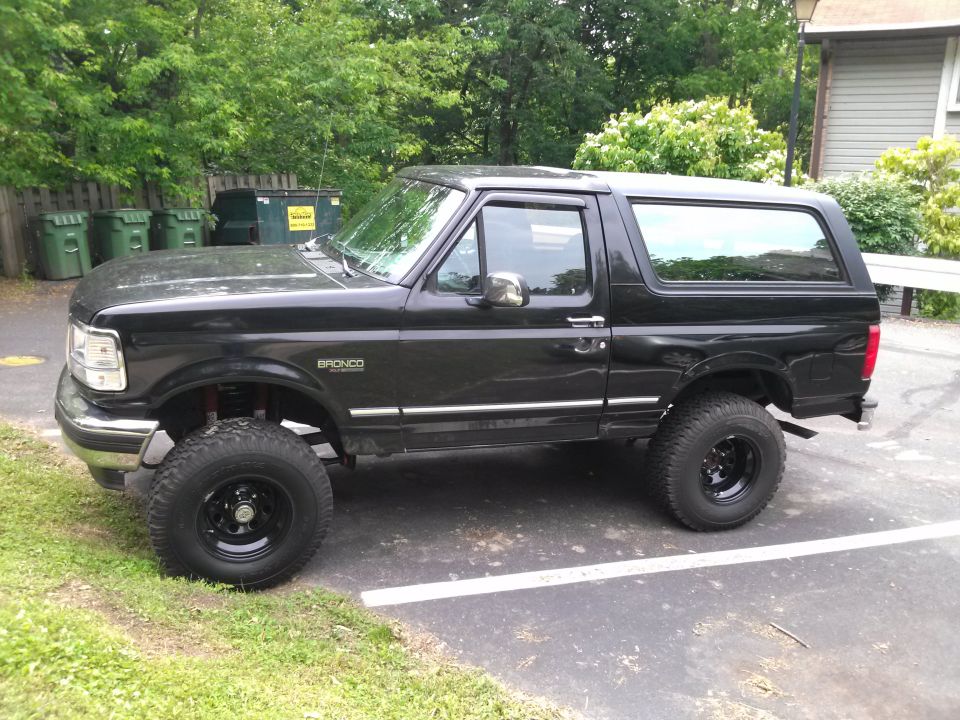 Black 1995 Ford Bronco side view with lifted suspension