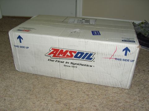 2007 Ford Mustang - A large AMSOIL branded box sits on a carpeted floor.