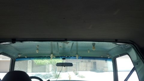 1995 Ford Bronco - The headliner in this vehicle is deteriorating, with foam pieces falling from the ceiling.