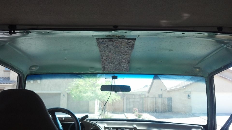 Interior view of a vehicle's headliner and windshield