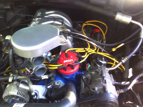 1993 Ford Bronco - Close-up view of an engine bay, showing various components and wiring.