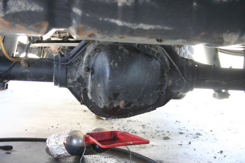 1991 Ford Bronco - Underside view of a vehicle's rear differential assembly during maintenance.