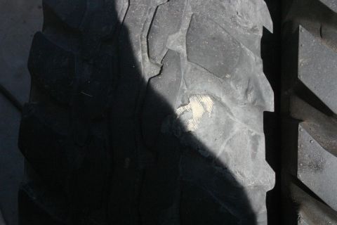 1991 Ford Bronco - A close-up view of a tire's tread pattern, showing wear and tear.