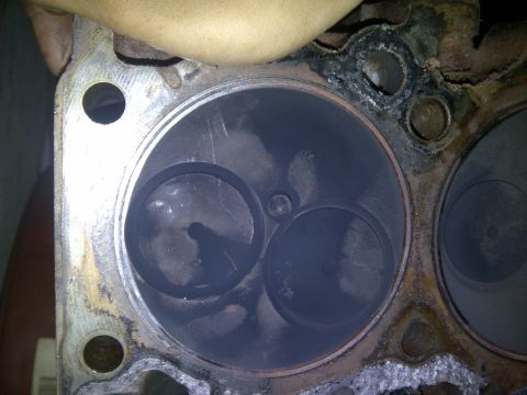 1986 Ford Bronco - This is a close-up view of an engine's cylinder head, showing two valves within a cylinder bore.
