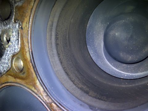 1986 Ford Bronco - This is a close-up view of an engine cylinder, showing wear and deposits on the inner wall.