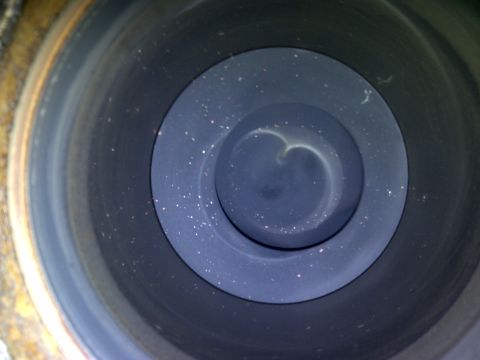 1986 Ford Bronco - Close-up view inside an engine cylinder, showing wear and carbon deposits.