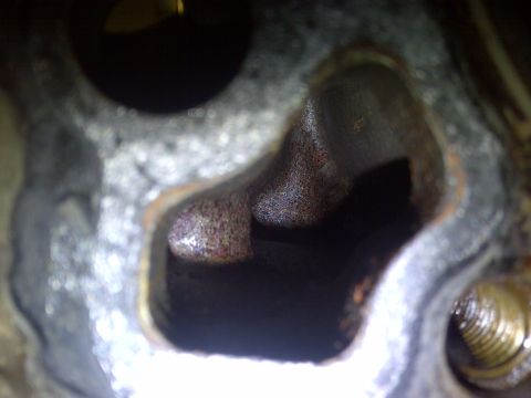 1986 Ford Bronco - Engine cylinder head port showing internal rust and wear.