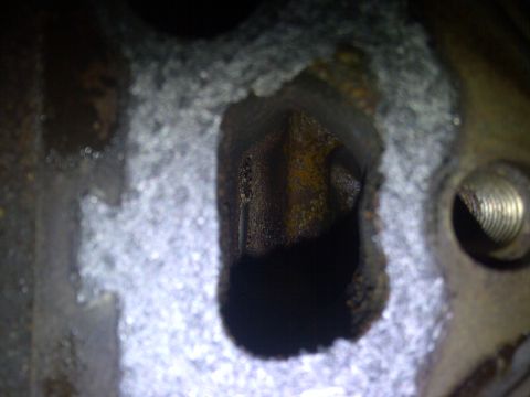 1986 Ford Bronco - This is a close-up view of an engine's cylinder bore, showing signs of wear and rust.