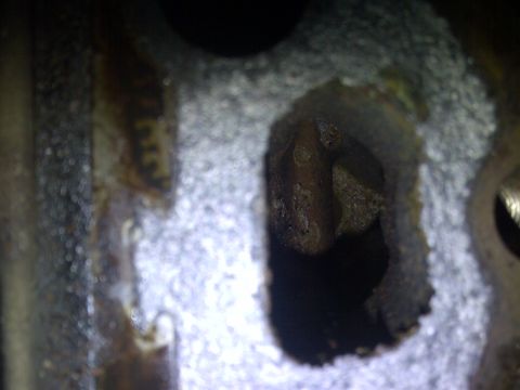 1986 Ford Bronco - This image shows a close-up view of a damaged engine component, not a 1986 Ford Bronco.