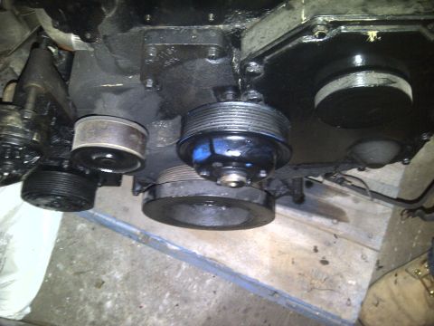 1986 Ford Bronco - Close-up view of engine pulleys and belts, likely part of a larger engine assembly.