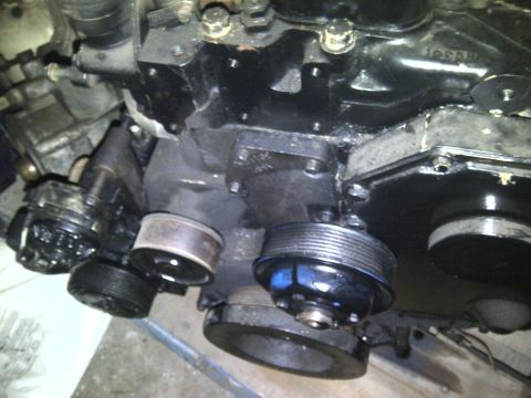 1986 Ford Bronco - Engine components, including multiple pulleys, are visible in this close-up shot.