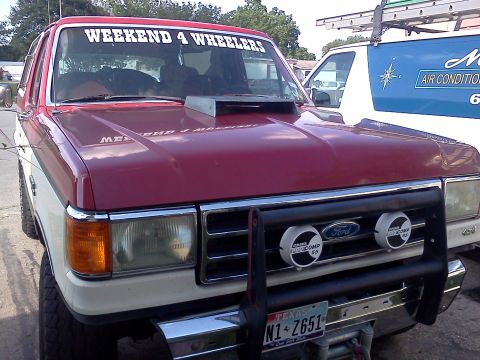 1989 Ford Bronco - This 1989 Ford Bronco features a custom hood scoop and a decal on the windshield.
