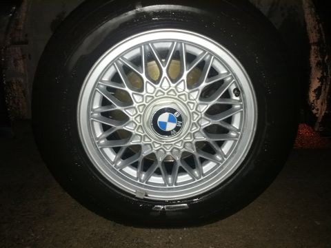 1991 BMW 3 Series - Close-up of a BMW wheel, a multi-spoke design and the iconic BMW emblem.