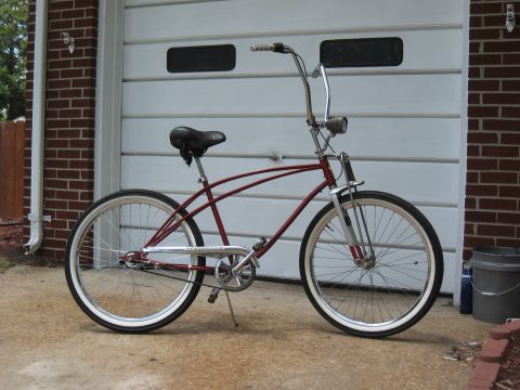 1994 Ford Bronco - A classic cruiser bicycle with a distinctive frame design is shown parked outdoors.