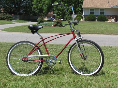 1994 Ford Bronco - Cruiser bicycle with a red frame and chrome accents sits on a grassy lawn.