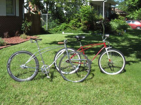 1994 Ford Bronco - Two classic cruiser bicycles are parked on a sunny day in a residential yard.