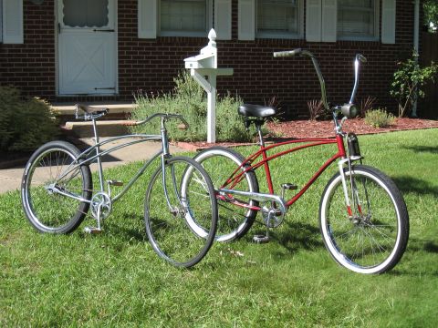 1994 Ford Bronco - Two cruiser bicycles are parked on the grass in front of a house.