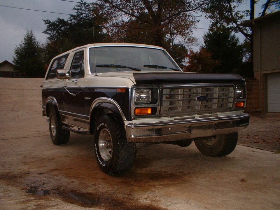 Two-tone blue and white full-size Ford Bronco, front three-quarter view