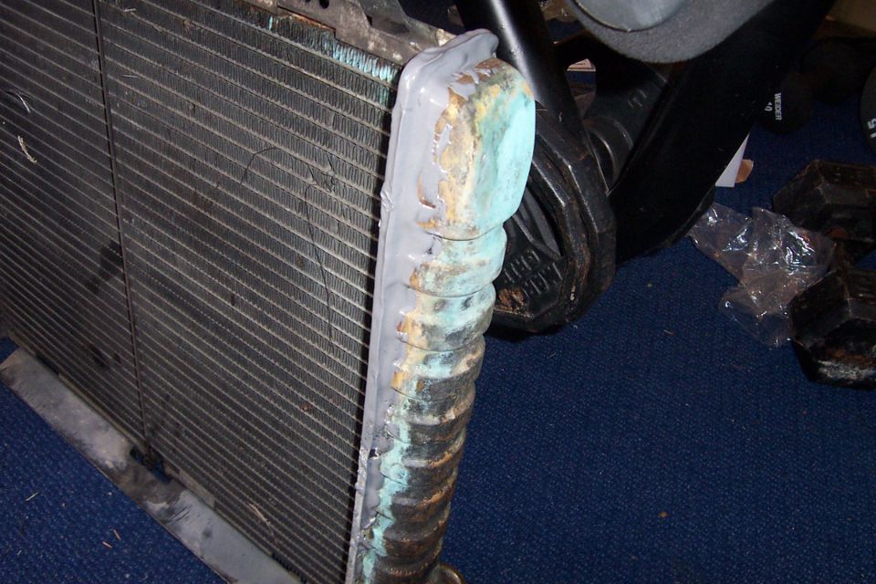 Radiator with corroded, JB-welded tanks and bent fins