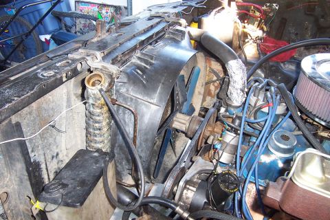 1980 Ford Bronco - Close-up view of a vehicle's engine bay, focusing on the radiator and fan assembly.