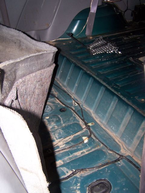1995 Ford Bronco - The bare metal floor and exposed wiring are visible inside this vehicle's interior.