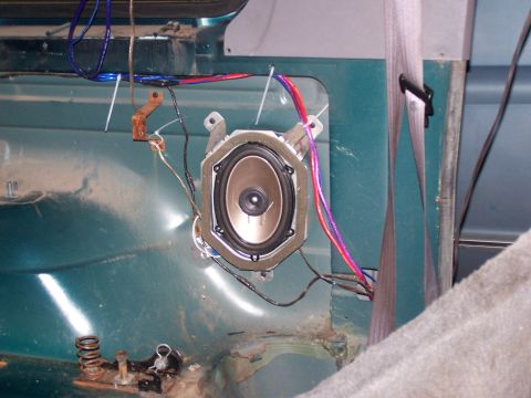 1995 Ford Bronco - Aftermarket speaker and wiring installed in the interior of a vehicle.