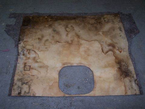 1995 Ford Bronco - This is a bed liner with a cutout, showing signs of water damage and wear.