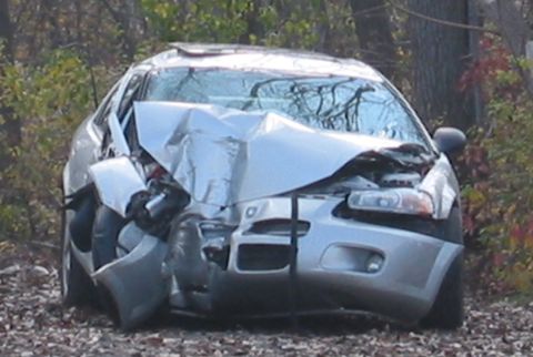 2001 Ford Taurus - This silver sedan sustained severe front-end damage in a collision.