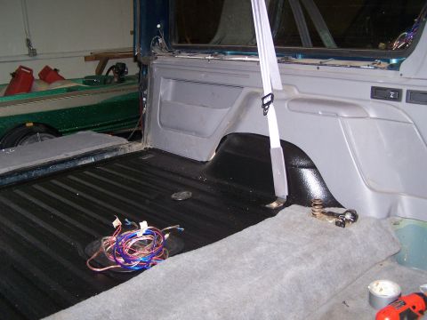1995 Ford Bronco - Wiring is visible in the cargo area of the vehicle, with a seatbelt extending into the frame.