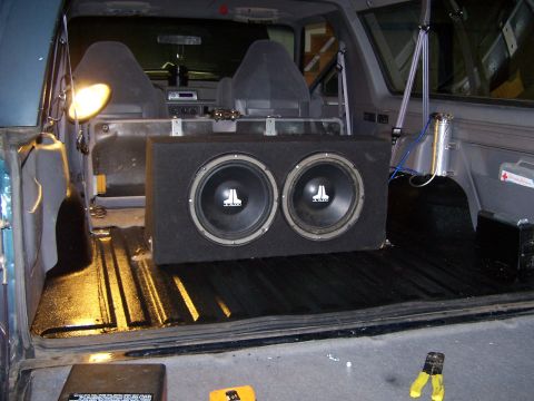 1995 Ford Bronco - Dual JL Audio subwoofer box installed in the cargo area of a 1995 Ford Bronco.