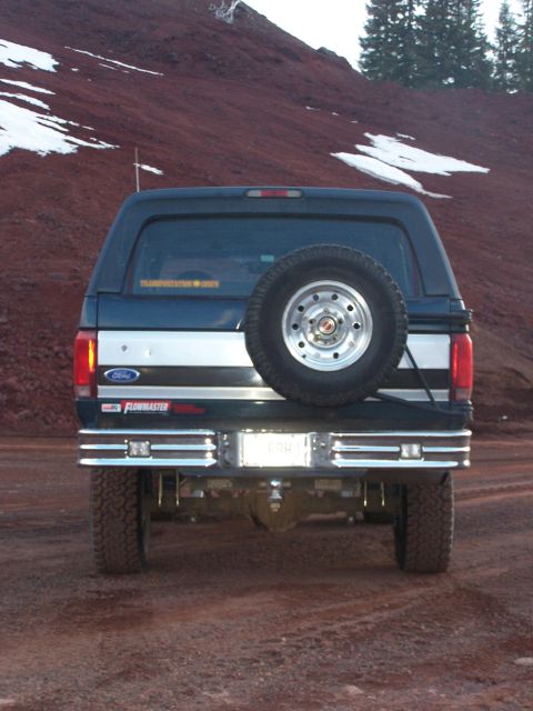 1995 Ford Bronco - This 1995 Ford Bronco is seen from the rear, a spare tire on the tailgate and a Flowmaster sticker on the bumper.