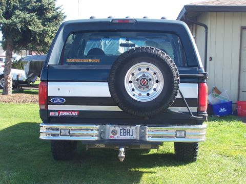 1995 Ford Bronco - This 1995 Ford Bronco features a rear-mounted spare tire and a Flowmaster sticker on the tailgate.