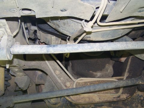 1995 Ford Bronco - Undercarriage view showing suspension components and fuel lines, likely from a truck or SUV.