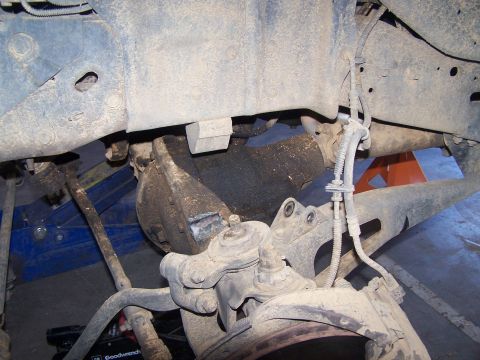 1995 Ford Bronco - Close-up of the front suspension and differential assembly on a 1995 Ford Bronco.