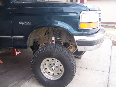 1995 Ford Bronco - Front view of a 1995 Ford Bronco XLT showing the fender, wheel, and suspension modifications.
