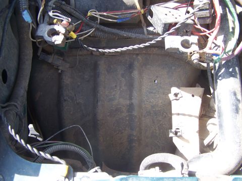 1995 Ford Bronco - A close-up view of the engine bay reveals a complex network of wiring and hoses.
