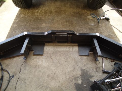 1995 Ford Bronco - A heavy-duty custom steel bumper is shown on a concrete surface, with tools nearby.