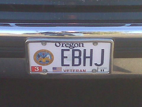 1995 Ford Bronco - Close-up of an Oregon license plate with the letters EB HJ and a veteran designation.