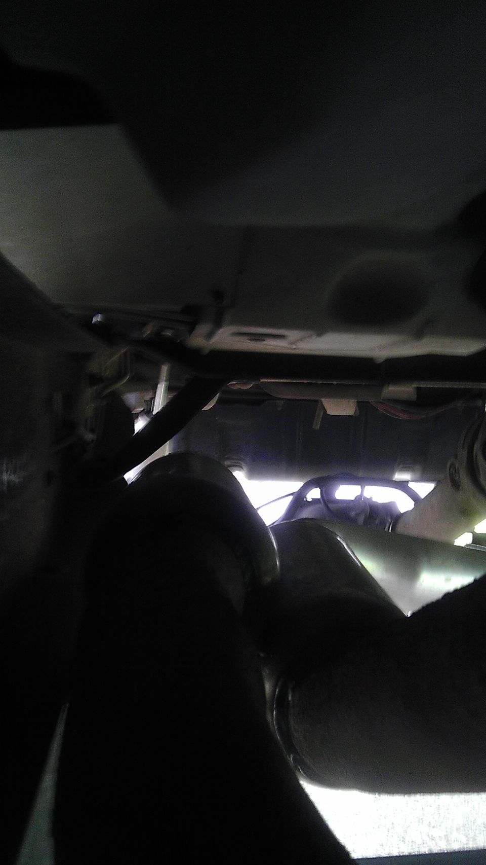 Exhaust pipe under a vehicle