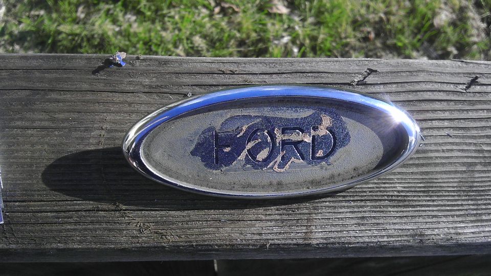 Ford oval badge on wooden planks