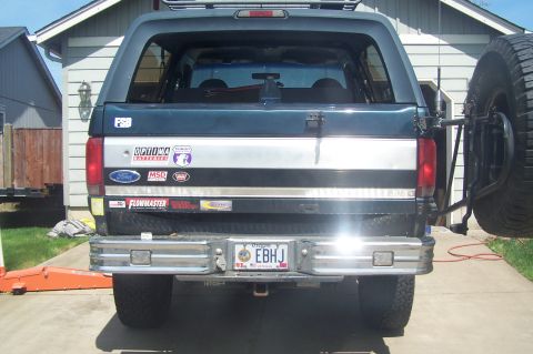 1995 Ford Bronco - Rear view of a 1995 Ford Bronco, showing its tailgate, bumper, and spare tire carrier.