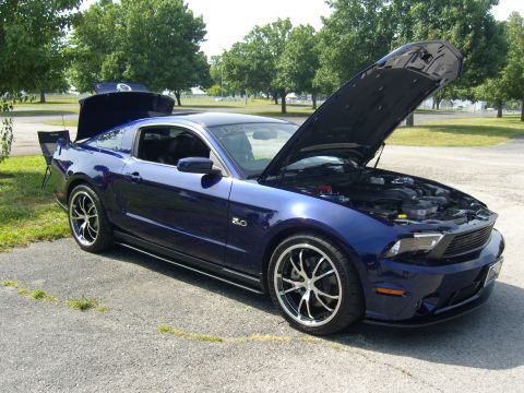 2007 Ford Mustang - Blue Ford Mustang parked outdoors with both the hood and trunk open.