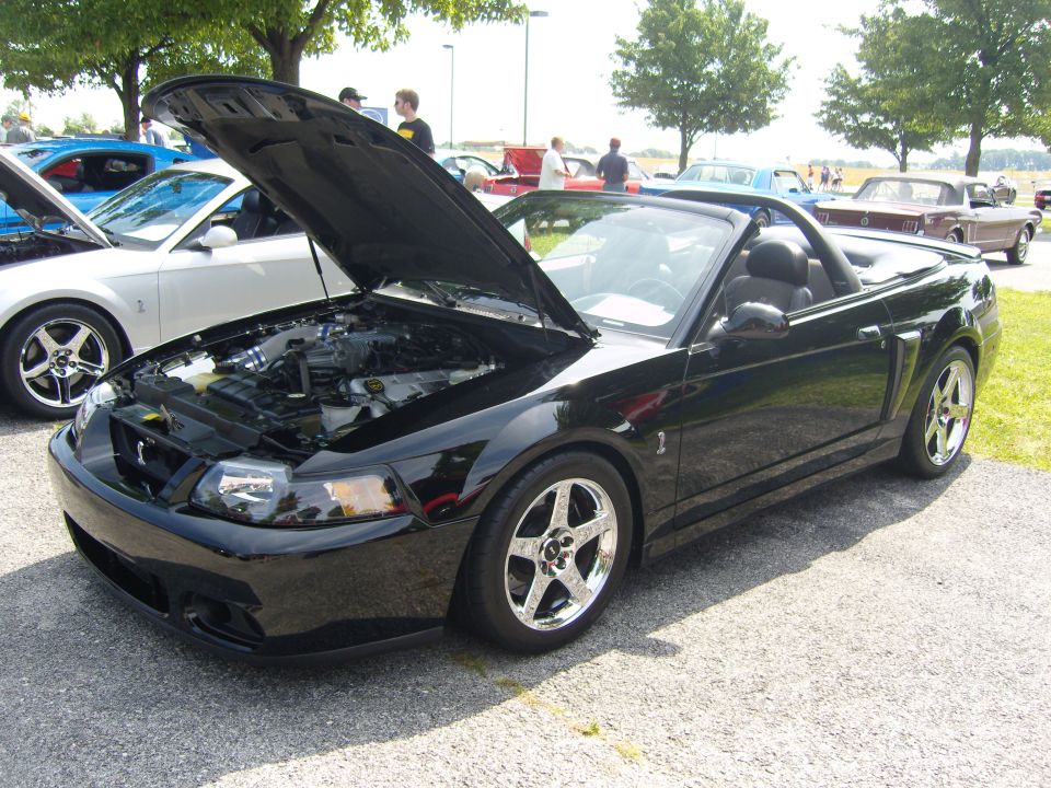 Black 2007 Ford Mustang convertible with hood open, showing engine