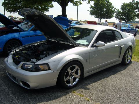 2007 Ford Mustang - Silver 2007 Ford Mustang on display at an outdoor car show event.