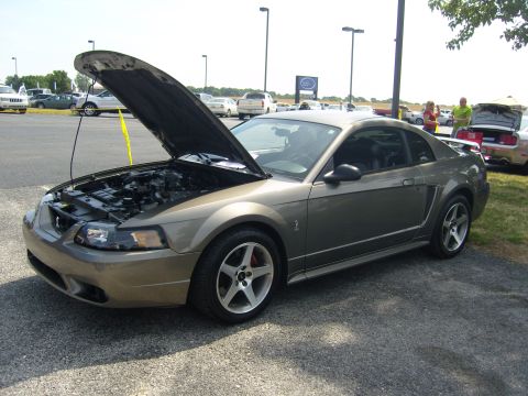 2007 Ford Mustang - A 2004 Ford Mustang is displayed with its hood open, revealing the engine compartment.