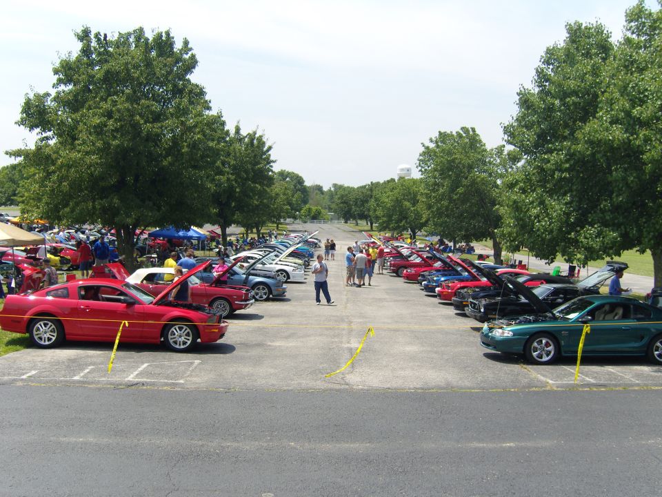 Red 2007 Ford Mustang parked at a car show