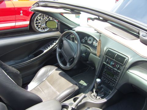 2007 Ford Mustang - Interior view of a convertible Mustang, with another Mustang visible in the background.